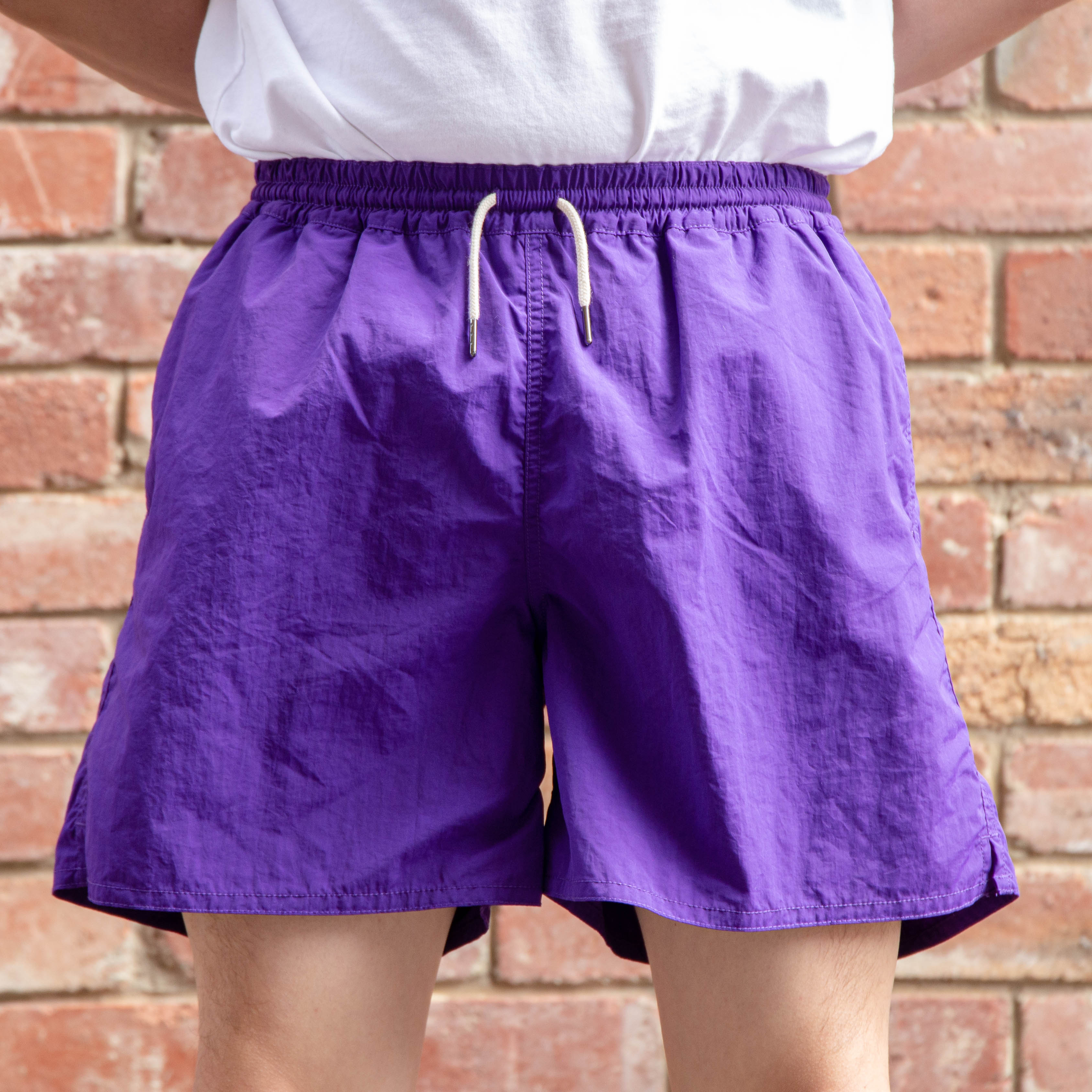 http://www.urbanlupe.com.au/cdn/shop/products/REMAINS_CLOTHING_1970S_OUTDOOR_5_INCH_SHORTS_PURPLE_1.jpg?v=1674554548